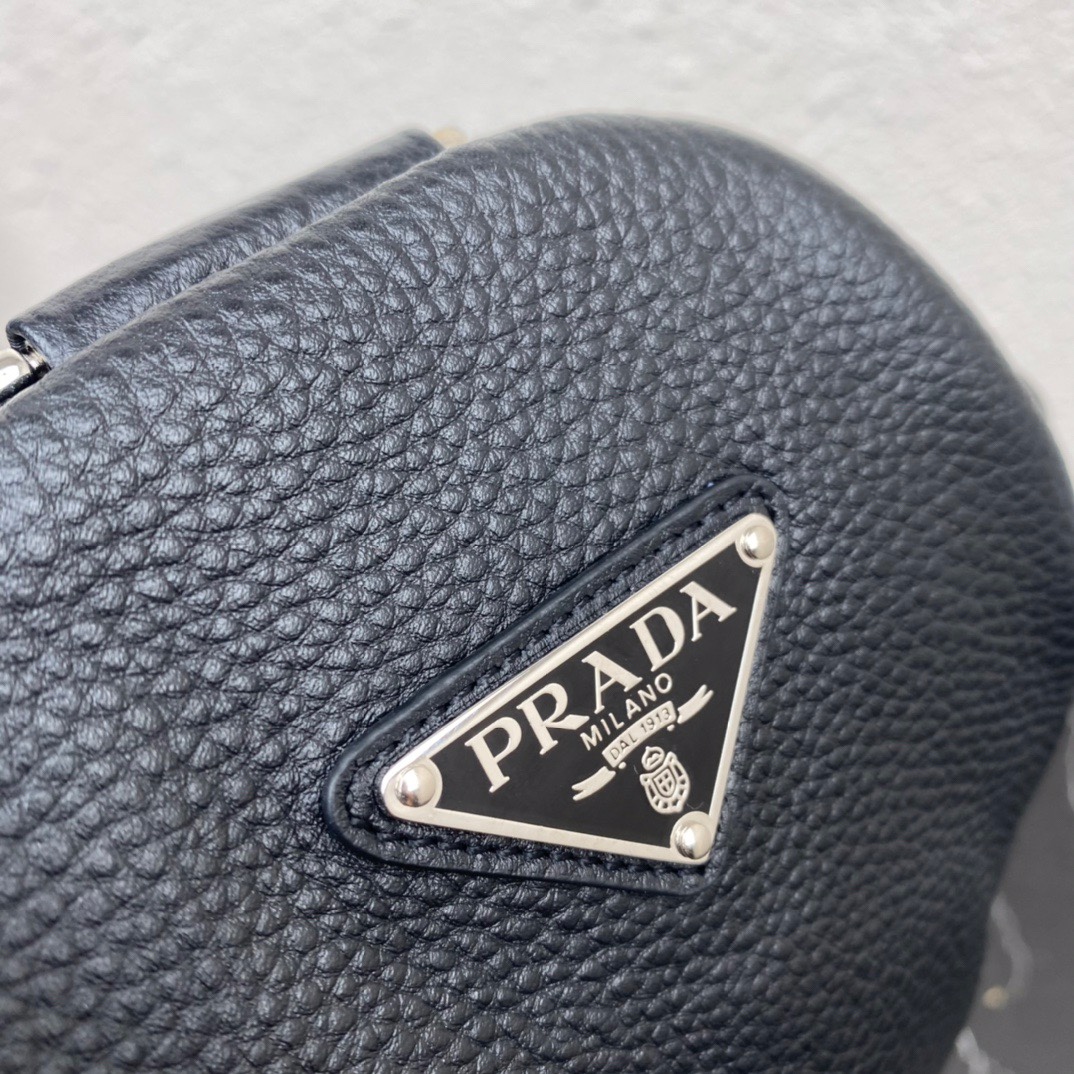 large leather Pra*a triangle bag