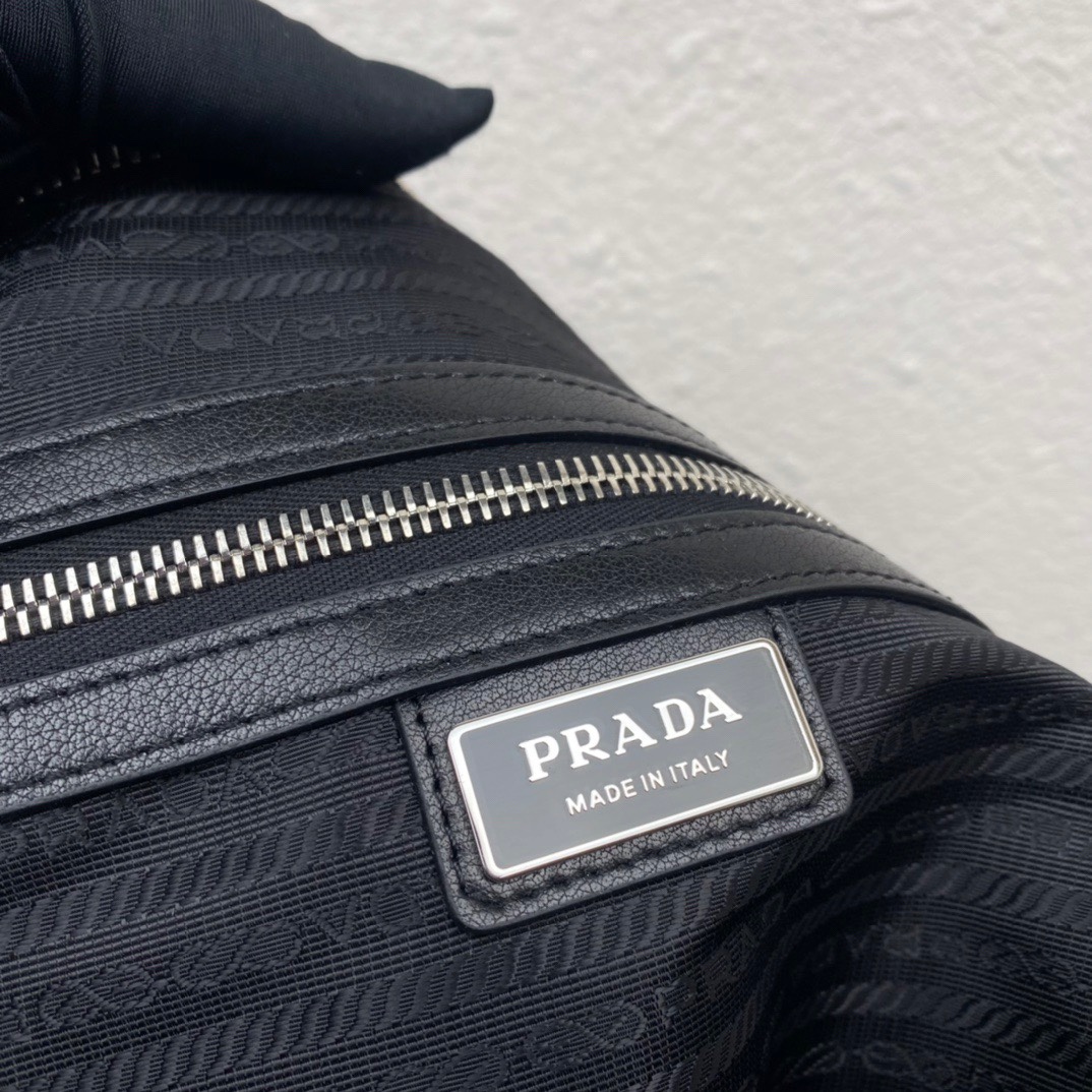 large leather Pra*a triangle bag